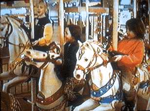 Image of Lila, Rebecca and Regina on the Merry-Go-Round